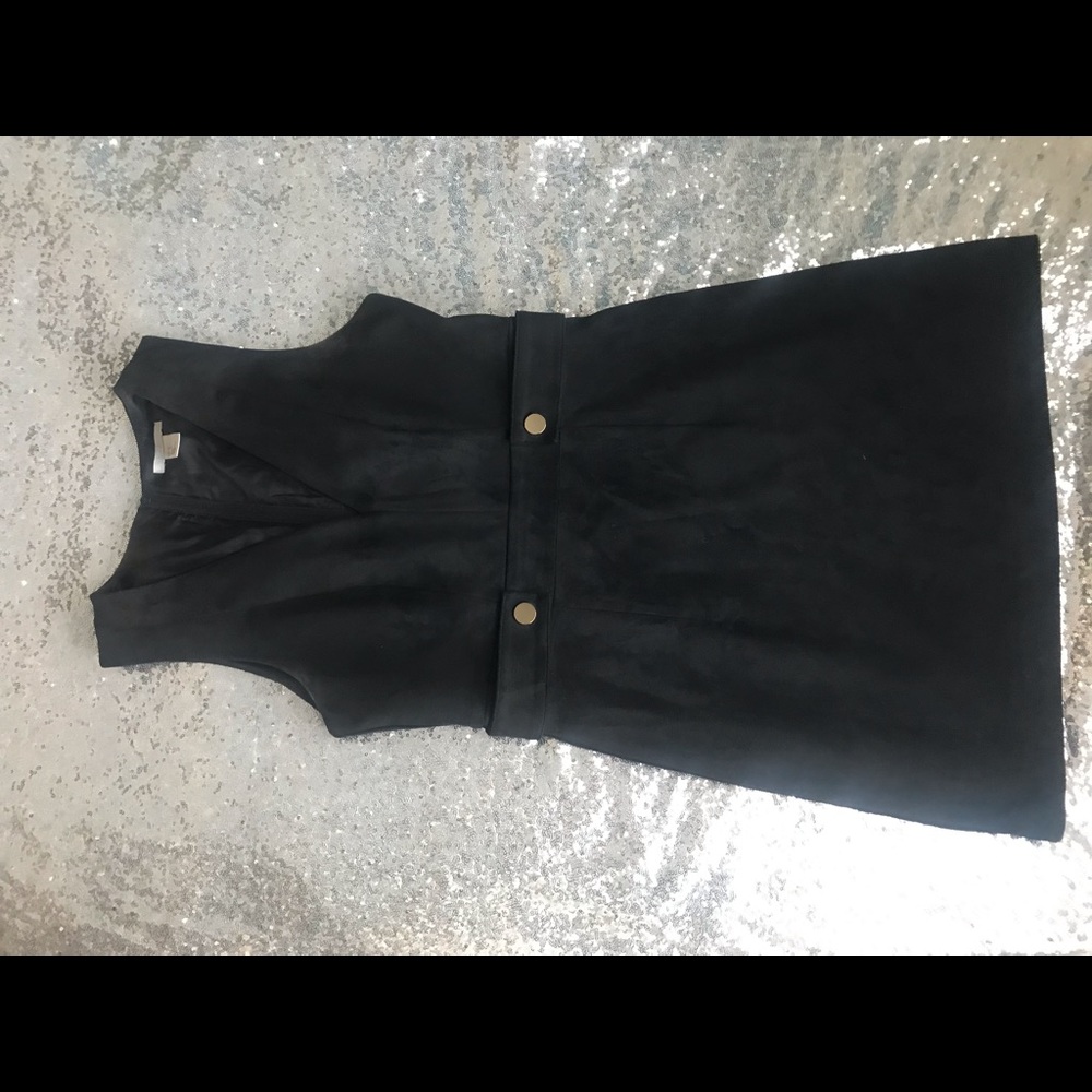 Black mini dress with golden button accent